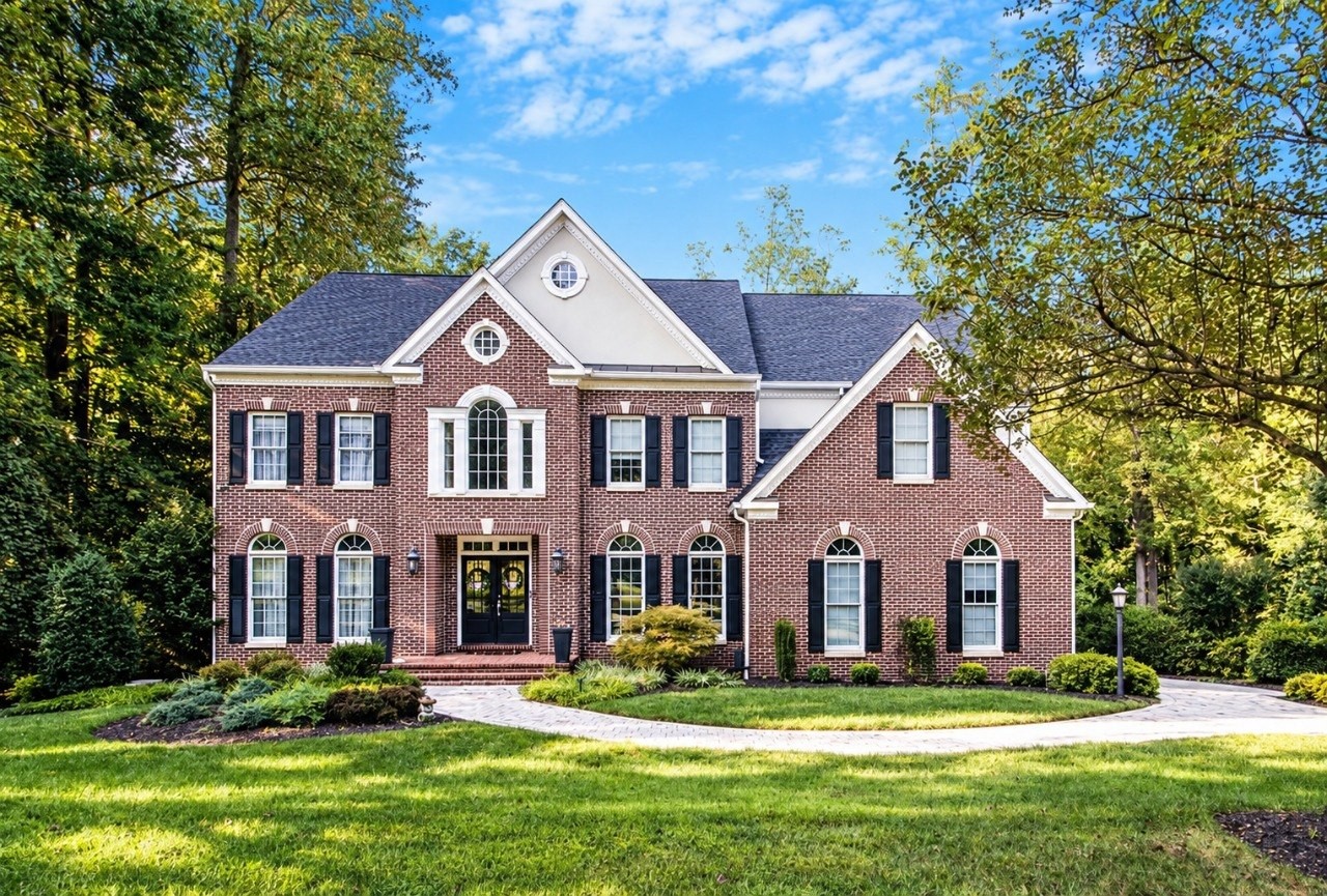 Large brick home in a wooded Davidsonville setting