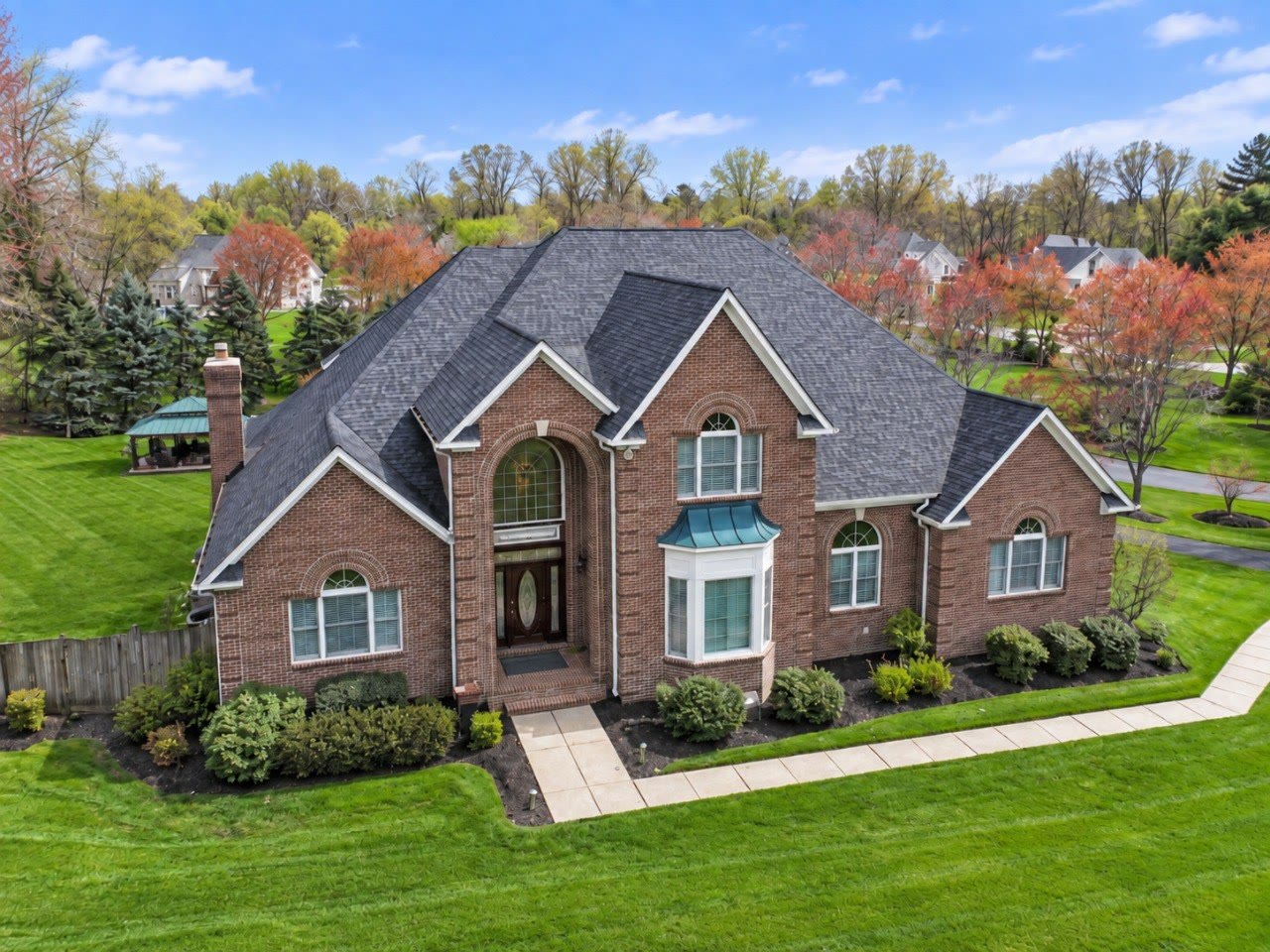Large brick home with landscaped grounds in Gambrills