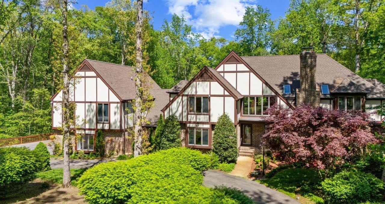 Tudor-style home surrounded by mature trees in Gambrills